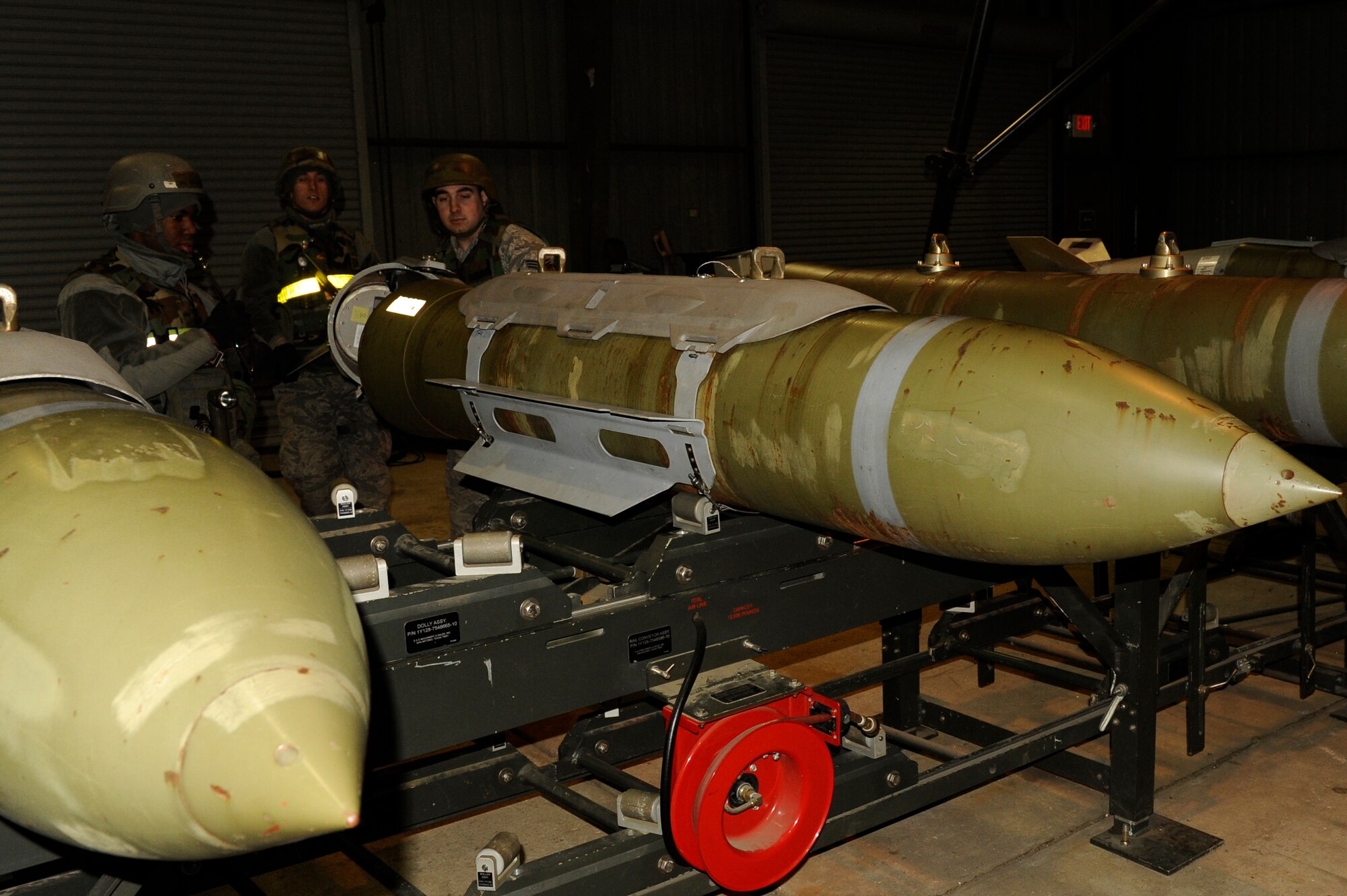 Airmen of the 8th Maintenance Squadron, assemble Joint Direct Attack Munitions during exercise Beverly Bulldog 13-2 at Kunsan Air Base, Republic of Korea, Feb. 12, 2013. The Airmen can assemble a JDAM in approximately three minutes. (U.S. Air Force photo by Senior Airman Marcus Morris/Released)