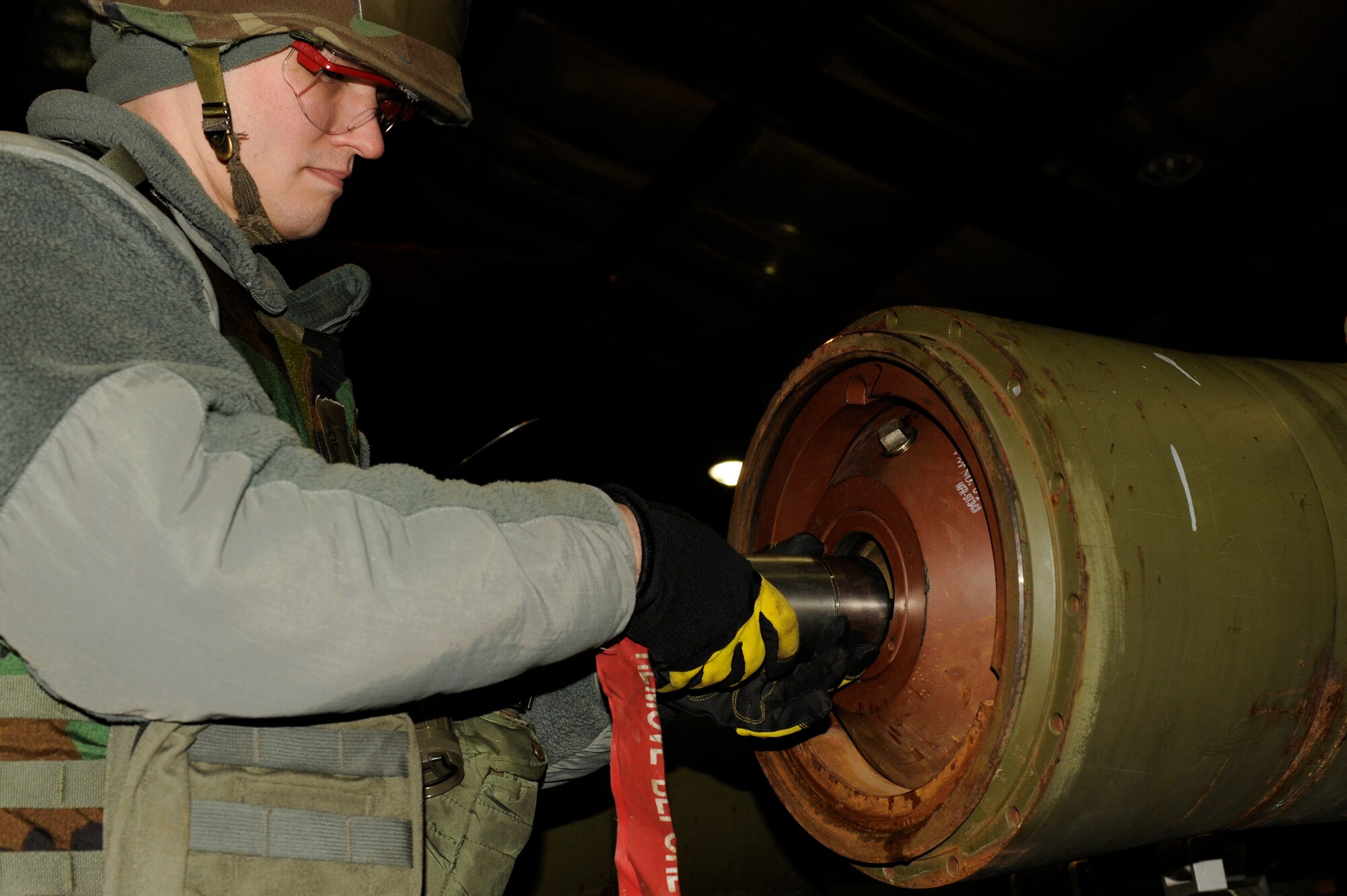 Staff Sgt Codey Newcomb, 8th Maintenance Squadron, assembles a Joint Direct Attack Munition during exercise Beverly Bulldog 13-2 at Kunsan Air Base, Republic of Korea, Feb. 12, 2013. The Airmen can assemble a JDAM in about three minutes. (U.S. Air Force photo by Senior Airman Marcus Morris/Released)