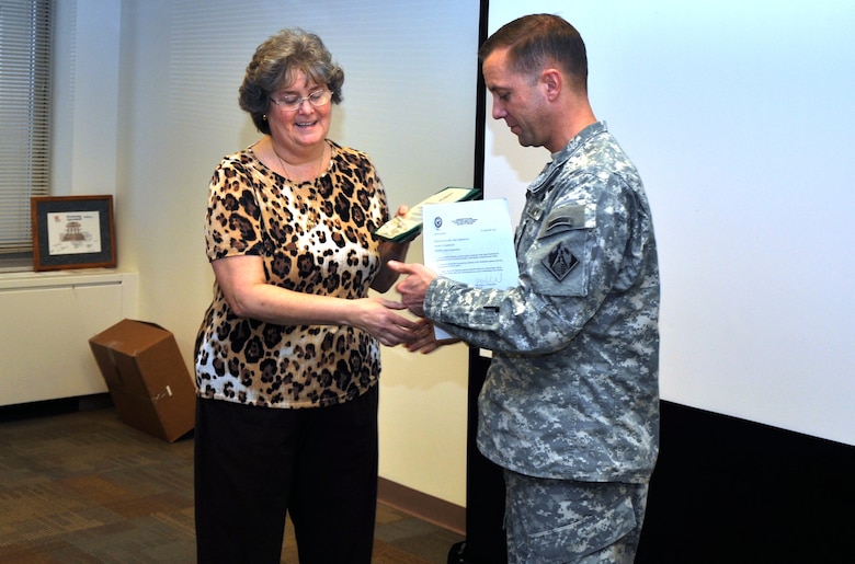 Connie Hardeman, left, receives a Certificate of Appreciation from Lt. Col. James A. DeLapp, Nashville District commander, Feb. 11, 2013 for her service during U.S. Army Corps of Engineers New York District’s response to Hurricane Sandy. She also served as an ENGLink Strikeforce member in the Emergency Operations section during her deployment there.