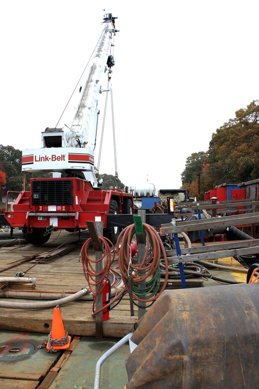 The U.S. Army Corps of Engineers Philadelphia District and its contractor Abhe & Svoboda Inc. use a barge as a staging area during repair work of the Point Pleasant Canal bulkhead. 