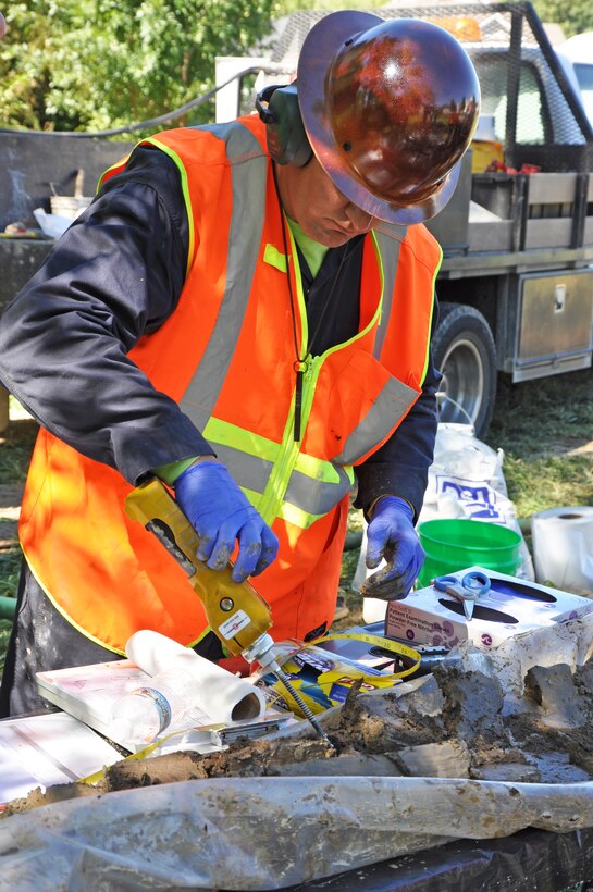 Contractor Steve Deeters uses a FID at Nike C-32 to further examine soil samples for contaminants.