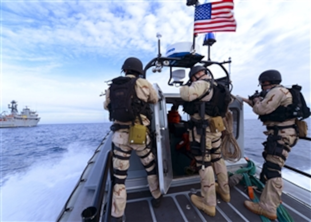 Sailors on a visit, board, search and seizure team race across the Atlantic Ocean on a rigid hull inflatable boat during a training exercise with the training support vessel USS Prevail (TSV 1) on Feb. 5, 2013.  The sailors are attached to the amphibious dock landing ship USS Carter Hall (LSD 50).  Carter Hall is participating in Composite Training Unit Exercise off the east coast of the U.S. in preparation for a deployment this spring.  