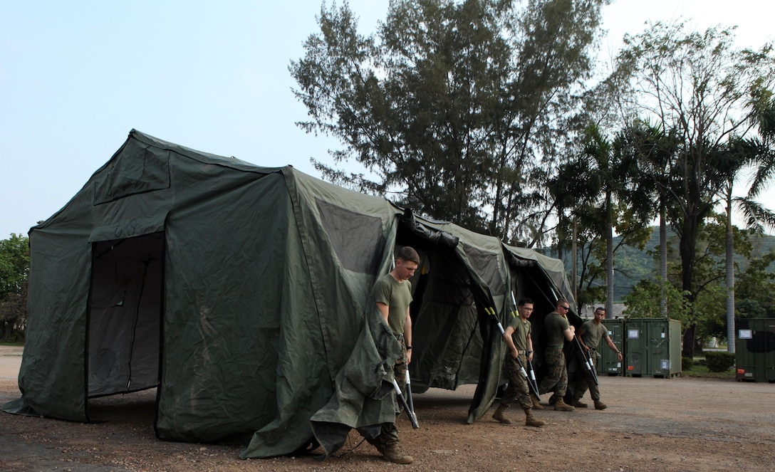 U.S. Marines from Combat Logistics Regiment 3 set up the tent to their combat operations center Feb. 9 at Camp Samaesan in Sattahip, Kingdom of Thailand, which will facilitate communications between logistics units throughout the country during exercise Cobra Gold 2013. â€œThe combat operations center will provide a central hub to facilitate communication to higher and laterally to logistics detachments throughout Thailand,â€ U.S. Marine 1st Lt. Francisco Pietri, the assistant operations officer for CLR-3, 3rd Marine Logistics Group, III Marine Expeditionary Force. CG 13 is the largest multinational exercise in the Asia-Pacific region and provides Thailand, the U.S., Singapore, Japan, Republic of Korea, Indonesia and Malaysia an opportunity to maintain relationships and enhance interoperability.