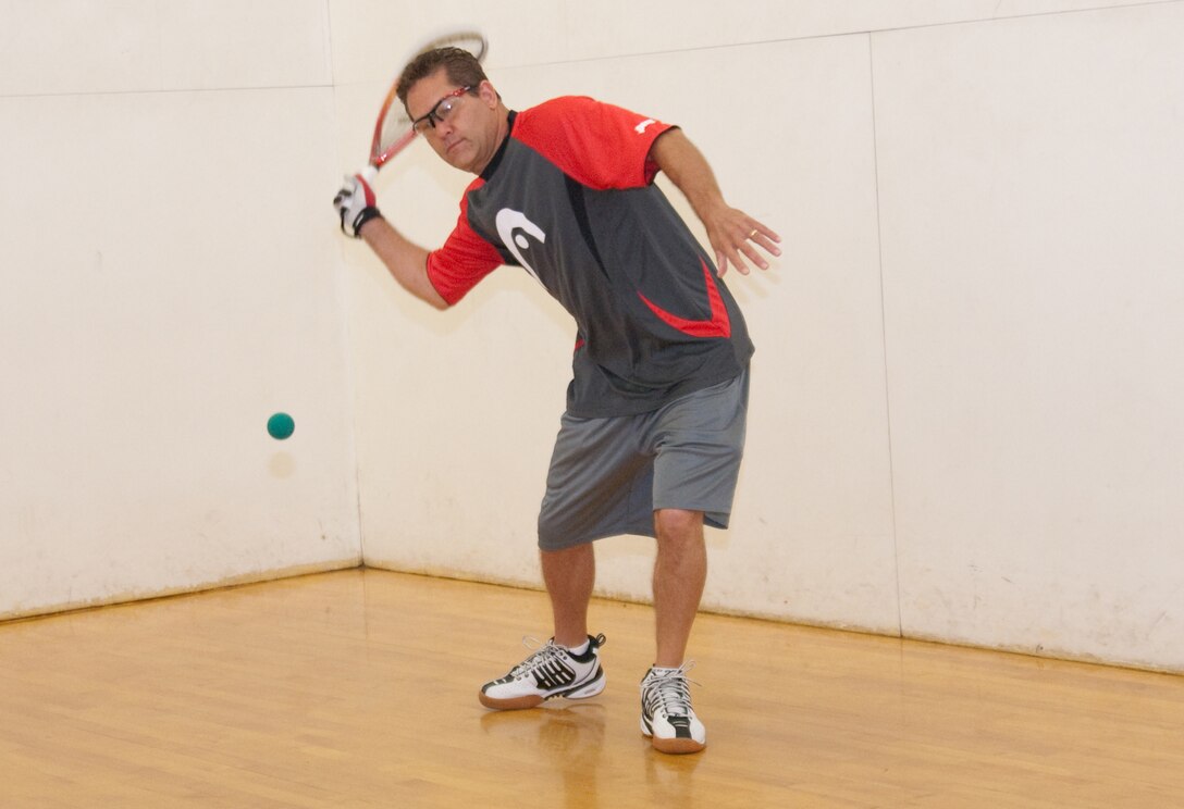 MARINE CORPS BASE HAWAII - Eric Foley takes a few practice swings at the Semper Fit Center, Feb. 13, 2013. Foley is the champion of Semper Fit’s fall racquetball tournament, which ran from October to January. He defeated Chris Varona, after a round of three games, of which the two best scores decide the winner, 15-5 and 15-7. Foley has played racquetball for more than 40 years, and 10 of those years he played with USA Racquetball. He has also placed second in the U.S. Open in Racquetball in 1986 in the 30 and over division, and again took second 2003 in the 40 and over division. He has played in three tournaments while in Hawaii. “I like the one-on-one competition,” Foley said. Another racquetball tournament is tentatively set for April. For more information about upcoming tournaments, call Semper Fit at 254-7597. (U.S. Marine Corps photo by Kristen Wong)