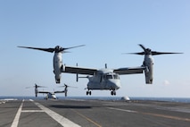 Marines belonging to Marine Test and Evaluation Squadron 22 carefully land aboard the USS Bush during a Military Utility Assessment to gauge the MV-22B Osprey's impact on normal naval aircraft carrier deck operations, Jan.29