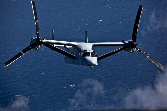 An Osprey piloted by Marines from Marine Corps Air Station New Rivers' Marine Test and Evaluation Squadron 22 heads towards the USS Bush aircraft carrier off the cost of Virginia.
