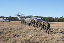 Marine Corps Air Station New River and Cherry Point squadrons join forces with Marines from Company C, 1st Battalion, 6th Marine Regiment, to complete a notional mission of killing or capturing a simulated high-value target during a raid. 