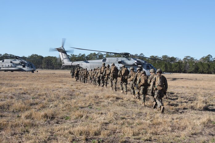 Marine Corps Air Station New River and Cherry Point squadrons join forces with Marines from Company C, 1st Battalion, 6th Marine Regiment, to complete a notional mission of killing or capturing a simulated high-value target during a raid. 