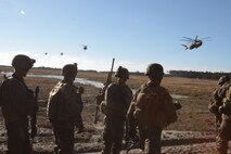 Marine Corps Air Station New River and Cherry Point squadrons join forces with Marines from Company C, 1st Battalion, 6th Marine Regiment, to complete a notional mission of killing or capturing a simulated high-value target during a raid. 