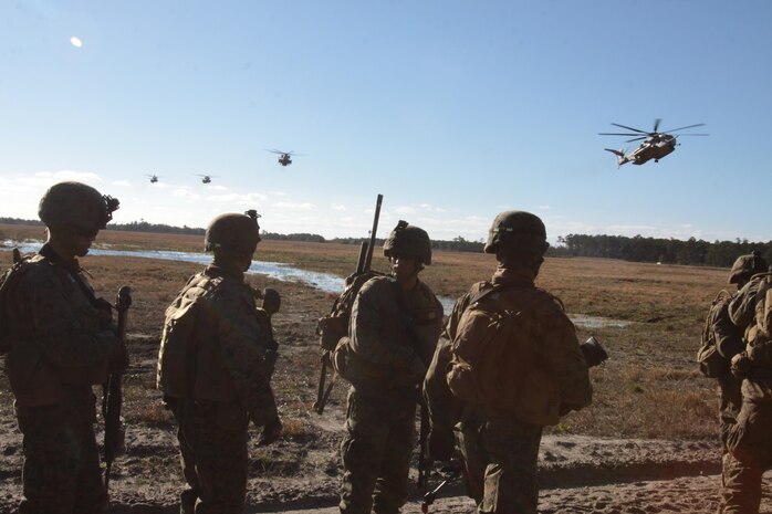 Marine Corps Air Station New River and Cherry Point squadrons join forces with Marines from Company C, 1st Battalion, 6th Marine Regiment, to complete a notional mission of killing or capturing a simulated high-value target during a raid. 