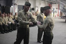 Sgt. Maj. Kenneth Redemacher receives the sword of office from Lt. Col. Richard F. Neitzey, commanding officer of Marine Heavy Helicopter Training Squadron 302 in a relief and appointment ceremony, Feb. 8. Redemacher replaced Sgt. Maj. Johnny L. Higdon Jr. 