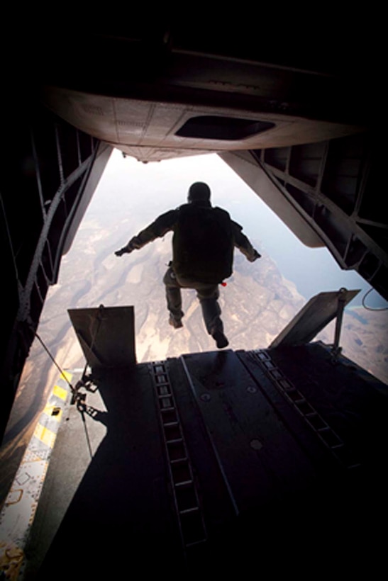 Gunnery Sgt. Steven Patrick, platoon sergeant, Force Reconnaissance Platoon, 15th Marine Expeditionary Unit, jumps out of a CH-153E Super Stallion, HMM 364 (Rein), 15th MEU and conducts an 8,000-foot freefall jump, Feb. 8. The 15th MEU is deployed as part of the Peleliu Amphibious Ready Group as a U.S. Central Command theater reserve force, providing support for maritime security operations and theater security cooperation efforts in the U.S. 5th Fleet area of responsibility. (U.S. Marine Corps photo by Gunnery Sgt. Jennifer Antoine/Released)