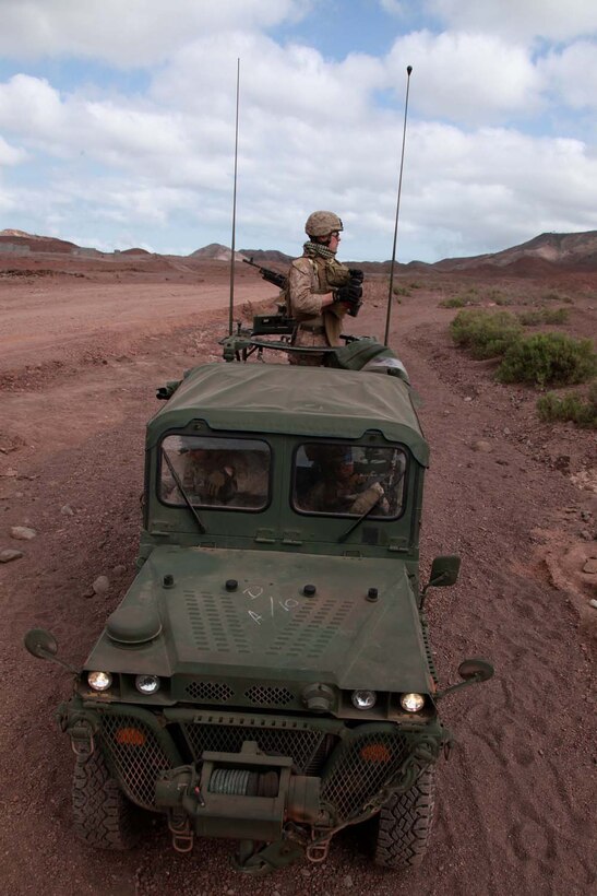 A light strike vehicle carrying Marines with Weapons Platoon, Kilo Company, Battalion Landing Team 3/5, 15th Marine Expeditionary Unit, stops during a unitâ€™s sustainment training convoy, Feb. 11.  The platoon practiced working with the unitâ€™s light strike vehicles, or LSVs, to increase unit cohesion, practice the fundamentals of their trades, and take advantage of a unique opportunity to train in a foreign country. The 15th MEU is deployed as part of the Peleliu Amphibious Ready Group as a U.S. Central Command theater reserve force, providing support for maritime security operations and theater security cooperation efforts in the U.S. 5th Fleet area of responsibility.  (U.S. Marine Corps photo by Cpl. John Robbart III/Released)