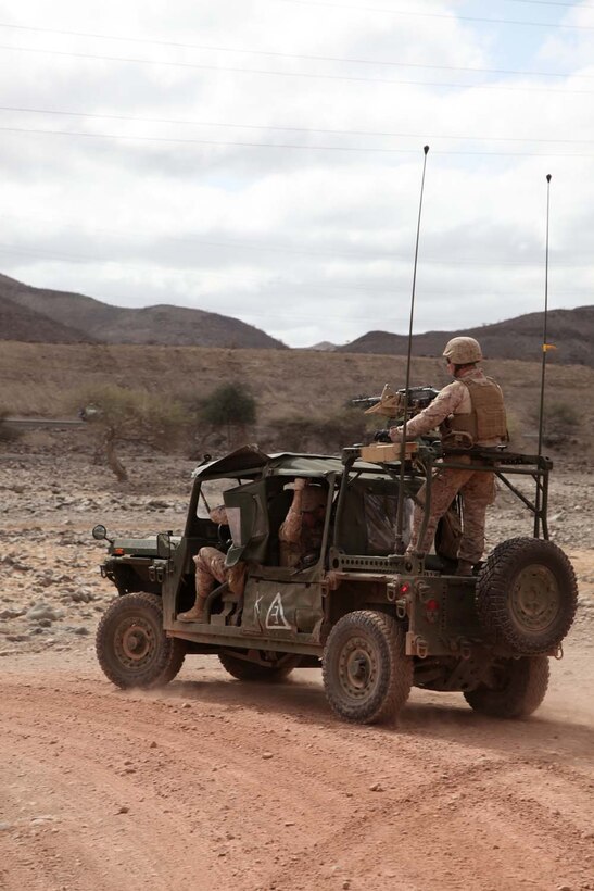 A light strike vehicle carrying Marines with Weapons Platoon, Kilo Company, Battalion Landing Team 3/5, 15th Marine Expeditionary Unit, convoys during unit sustainment training, Feb. 11.  The platoon practiced working with the unitâ€™s light strike vehicles, or LSVs, to increase unit cohesion, practice the fundamentals of their trades, and take advantage of a unique opportunity to train in a foreign country. The 15th MEU is deployed as part of the Peleliu Amphibious Ready Group as a U.S. Central Command theater reserve force, providing support for maritime security operations and theater security cooperation efforts in the U.S. 5th Fleet area of responsibility. (U.S. Marine Corps photo by Cpl. John Robbart III/Released)