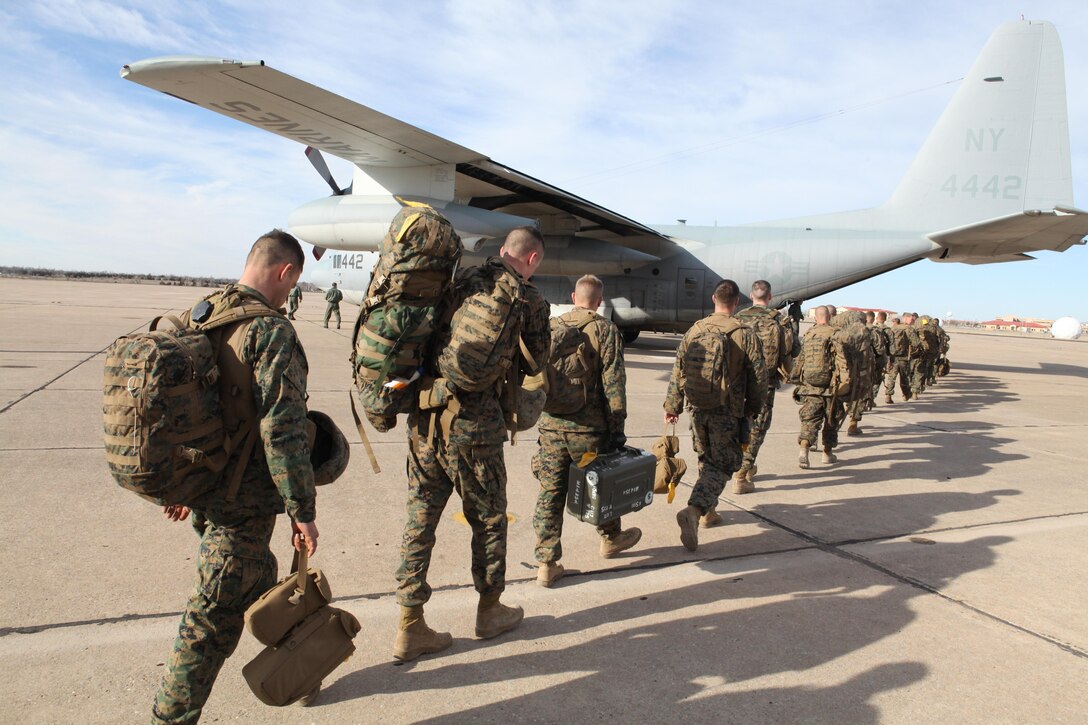 Marines of Battery Q, 5th Battalion, 14th Marine Regiment load into a C-130 Hercules aircraft to return to Aurora, Colo., after the Mission Rehearsal Exercise for African Lion 2013. The troops, assigned to Marine Forces Reserve, performed various live-fire battle drills before the unit deploys to AL-13 in Morocco this spring. This will be the first time the unit will demonstrate both High-Mobility Artillery Rocket System and M777 Howitzer capabilities for their Moroccan partners. African Lion is an annual multinational exercise executed under the supervision of Marine Forces Africa Command. (U.S. Marine Corps photo by Sgt. Ray Lewis/Released)
