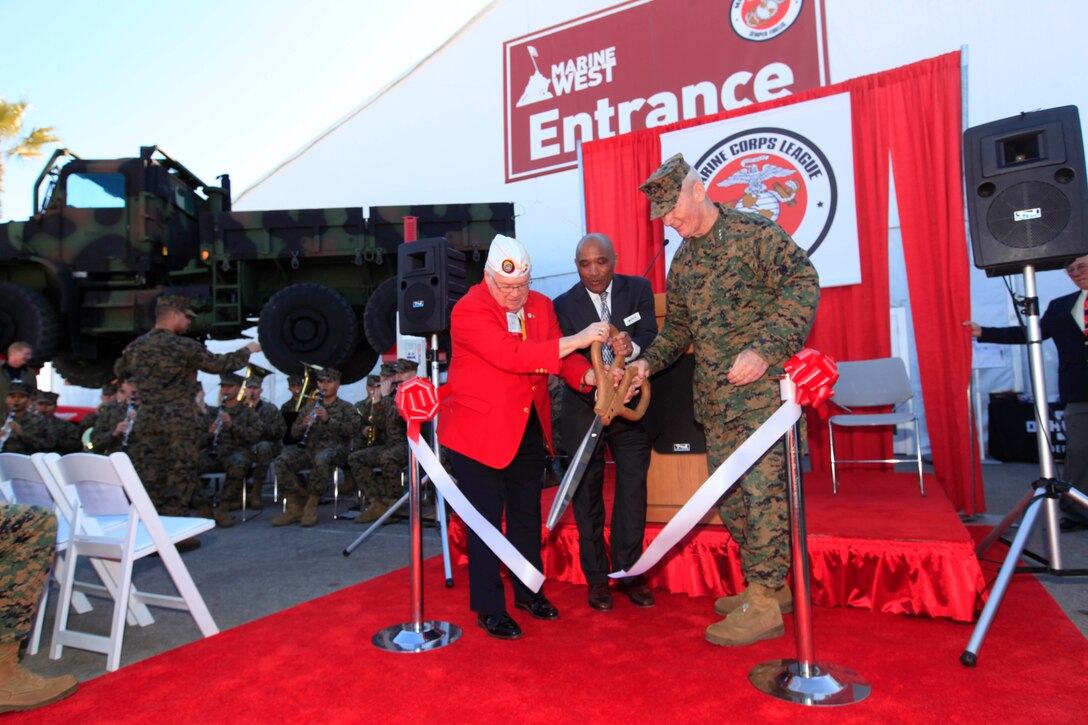 Lt. Gen. John A. Toolan, right, I Marine Expeditionary Force commanding general, retired Lt. Gen. Ronald Coleman, center, host of the Marine West Expo, and Jim Tuohy, the national commandant of the Marine Corps League, cut the ribbon to open the Marine West Expo at Del Mar Beach here Feb. 13.