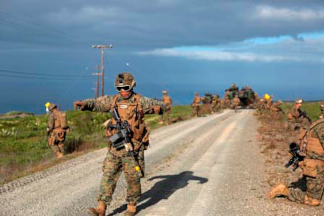 130210-M-SA237-056SAN CLEMENTE ISLAND, Calif.- Cpl. Edwin Eslava, a Glendale, Calif. native and squad leader with 2nd Platoon, Bravo Company, 1st Battalion, 4th Marine Regiment, 13th Marine Expeditionary Unit, directs his Marines to set up a perimeter during a patrol as part of Exercise Iron Fist 2013, on San Clemente Island, Calif. Feb. 10, 2013. During Exercise Iron Fist 2013, the 13th MEU and JGSDF will spend three weeks participating in bilateral training to improve their interoperability, enhance military-to-military relations, and sharpen skills essential to crisis response. (U.S. Marine Corps photo by Lance Cpl. Lonzo-Grei Thornton/Released)