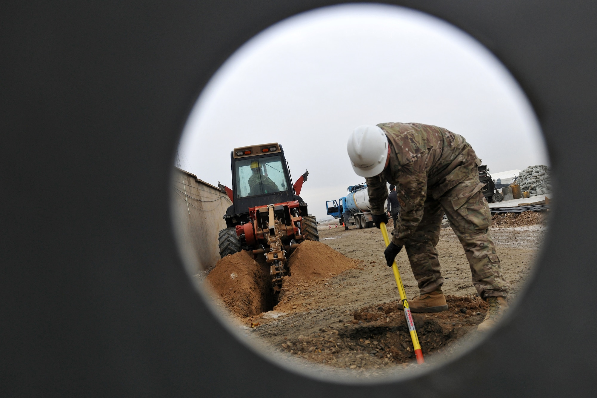 Members of the 272nd Engineering and Installation Squadron dig trenches in order to install fiber optic cables through Camp Pratt, Afghanistan, Feb. 1, 2013.  The 272nd EIS are tasked with constructing the communications infrastructure used by thousands of servicemembers and military contractors at the Camps located near the city of Mazar-e-Sharif. (U.S. Air Force photo/Senior Airman Chris Willis)
