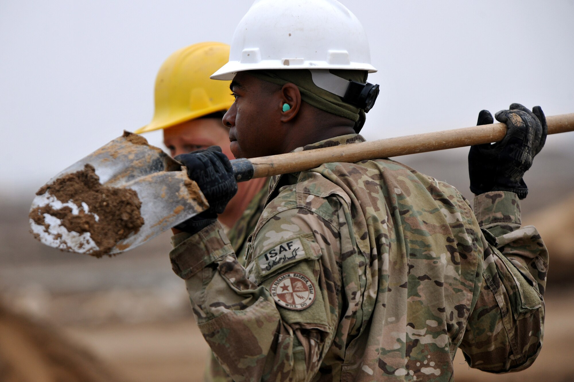 Staff Sgt. Ronald Wallace, 272nd Engineering and Installation Squadron craftsman, supervises the construction of a conduit through Camp John Pratt, Afghanistan, Jan. 31, 2013. Wallace, a Houston, Texas, native, is part of a team tasked to lay the entire fiber optic cable infrastructure connecting Camp Marmal to Camp John Pratt.  (U.S. Air Force photo/Senior Airman Chris Willis)