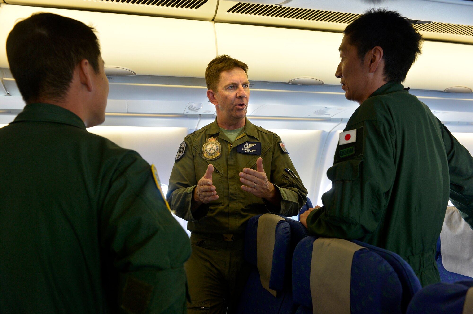 Royal Australian Air Force Warrant Officer Darrell Bent, an air refueling operator on the KC-30A Multi Role Tanker Transport, briefs members of the Japan Air Self Defense Force on the KC-30A's operations while flying a refuel mission during Cope North 13 near Anderson Air Force Base, Guam, Feb. 13, 2013. The KC-30 refueling systems are controlled by an Air Refuelling Operator in the cockpit, who can view refuelling on 2D and 3D screens. Cope North is an annual air combat tactics, humanitarian assistance and disaster relief exercise designed to increase the readiness and interoperability of the U.S. Air Force, Japan Air Self-Defense Force and Royal Australian Air Force.. (U.S. Air Force photo by Senior Airman Matthew Bruch/Released)
