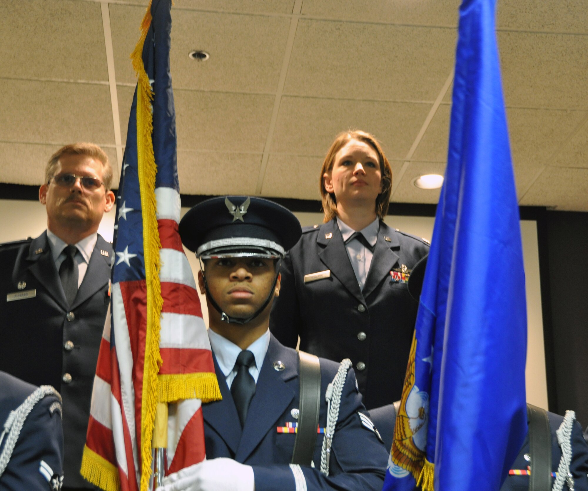 Lt. Col. Amee Howard, right, and Col. Jeffrey Pickard, 507th Maintenance Group commander, left, stand at attention for the playing of the National Anthem during the 507th Maintenance Operations Flight assumption of command ceremony, Feb. 3, 2013.  Lt. Col. Howard assumes command from Maj. Carl Jones, (not shown) after she served three years as the 507th Maintenance Group executive officer.  Maj. Jones now serves as the 507th Aircraft Maintenance Squadron commander.  (U.S. Air Force photo by Senior Airman Mark Hybers)