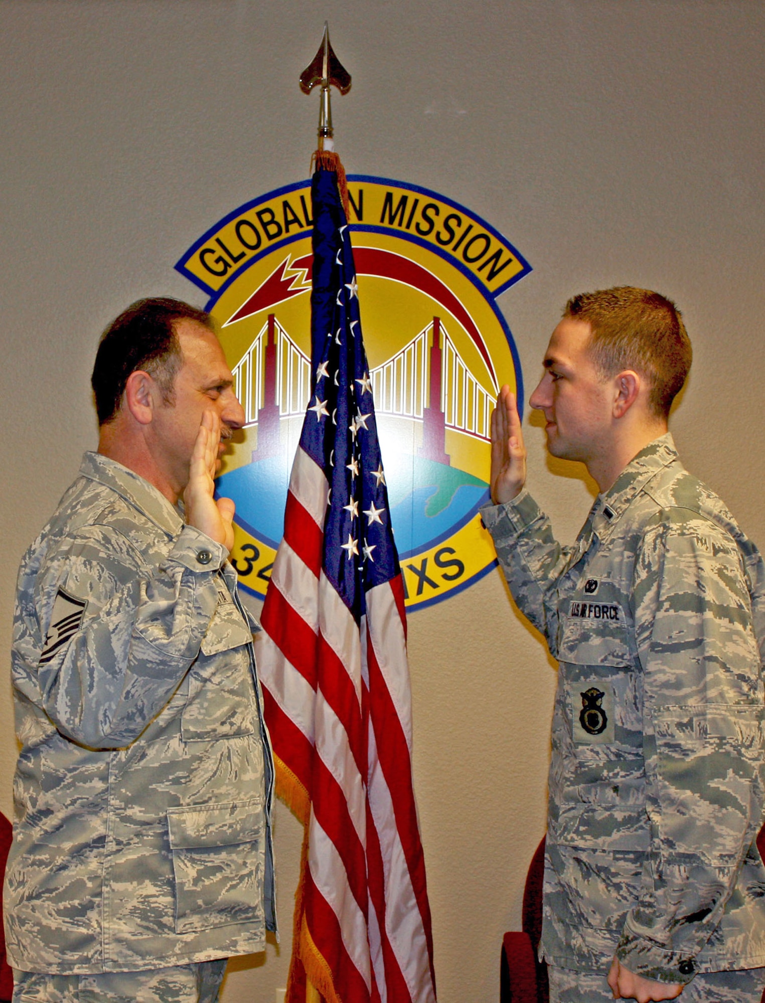 TRAVIS AIR FORCE BASE, Calif. -- Two generations of Perrottas came together recently here to make new history. Master Sgt. Camillo C. Perrotta, Sr., a reservist with the 349th Maintenance Squadron, was sworn in for his next to last enlistment by 1st Lt. Camillo C. Perrotta, Jr. (Courtesy photo)