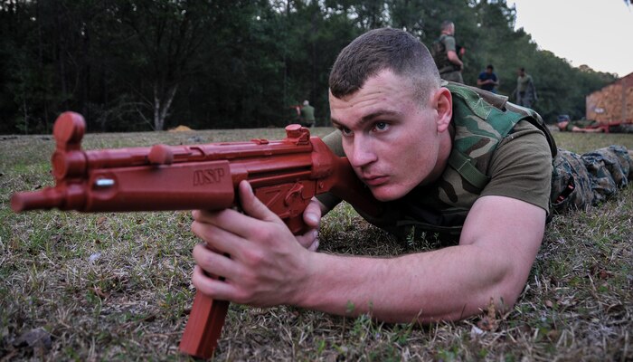 U.S. Marine Corps Pfc. Trae Neumann, a Naval Consolidated Brig Charleston corrections specialist, inspects his area of responsibility during Marine Corps Martial Arts Program training Feb. 7, 2013, at Joint Base Charleston – Weapons Station, S.C. MCMAP is a hand-to-hand, close quarter combat and weapons training program designed to educate, improve technique and boost morale throughout the Corps. Marines stationed at the NCBC participate in MCMAP four times a week. (U. S. Air Force photo/Airman 1st Class Jared Trimarchi) 