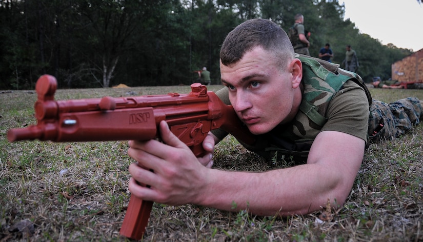 U.S. Marine Corps Pfc. Trae Neumann, a Naval Consolidated Brig Charleston corrections specialist, inspects his area of responsibility during Marine Corps Martial Arts Program training Feb. 7, 2013, at Joint Base Charleston – Weapons Station, S.C. MCMAP is a hand-to-hand, close quarter combat and weapons training program designed to educate, improve technique and boost morale throughout the Corps. Marines stationed at the NCBC participate in MCMAP four times a week. (U. S. Air Force photo/Airman 1st Class Jared Trimarchi) 