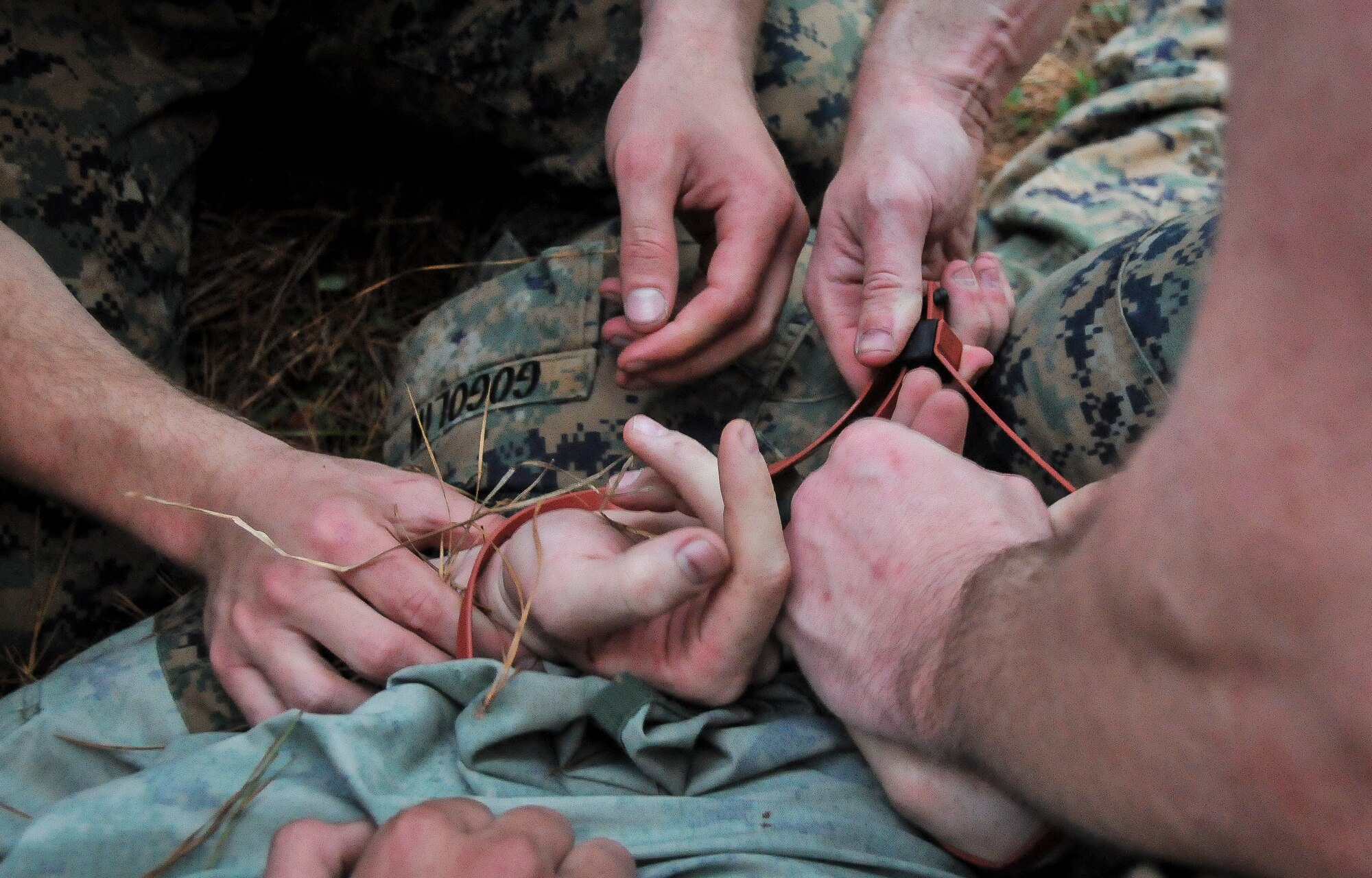U.S. Marine Corps Cpl. Zachary Gogolin, a Naval Consolidated Brig Charleston corrections specialist, is handcuffed during Marine Corps Martial Arts Program training Feb. 7, 2013, at Joint Base Charleston – Weapons Station, S.C. MCMAP is a hand-to-hand, close quarter combat and weapons training program designed to educate, improve technique and boost morale throughout the Corps . Marines stationed at the NCBC participate in MCMAP four times a week. (U. S. Air Force photo/Airman 1st Class Jared Trimarchi) 