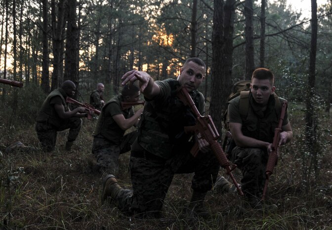 U.S. Marine Corps Sgt. Cody Prickett, a Naval Consolidated Brig Charleston corrections specialist, directs a fire team leader during Marine Corps Martial Arts Program training Feb. 7, 2013, at Joint Base Charleston – Weapons Station, S.C. MCMAP is a hand-to-hand, close quarter combat and weapons training program designed to educate, improve technique and boost morale throughout the Corps. Marines stationed at the NCBC participate in MCMAP four times a week. (U. S. Air Force photo/Airman 1st Class Jared Trimarchi) 