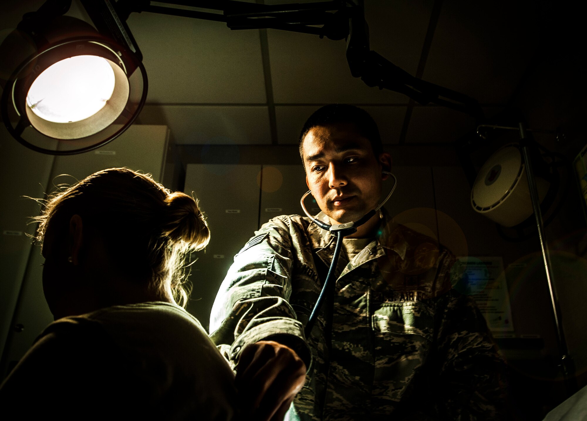 Staff Sgt. Darin Hoki, 628th Medical Group Independent Duty Medical Technician, demonstrates conducting a routine exam on an Airman at Joint Base Charleston – Air Base, Feb. 12, 2013. The IDMTs’ mission is to save lives while accomplishing various jobs. They provide and manage patient care while at home station. (U.S. Air Force photo / Airman 1st Class Tom Brading)