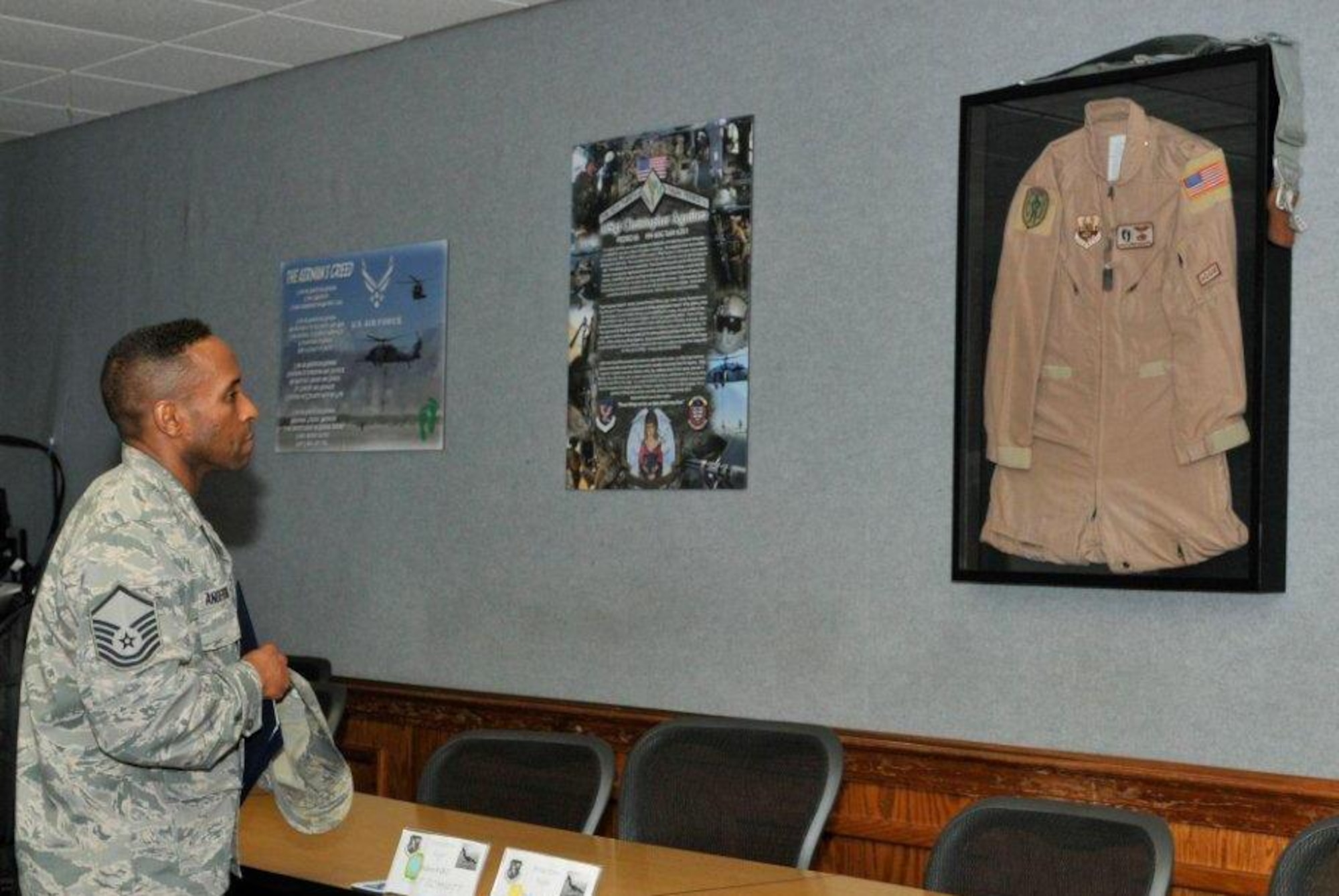 Master Sgt. Michael Anderson, Airey NCO Academy NCO in charge, surveys the room dedicated to Master Sgt. Christopher Aguilera Feb. 12 at the Airey NCO Academy. (U.S. Air Force photo by Susan L. Trahan)