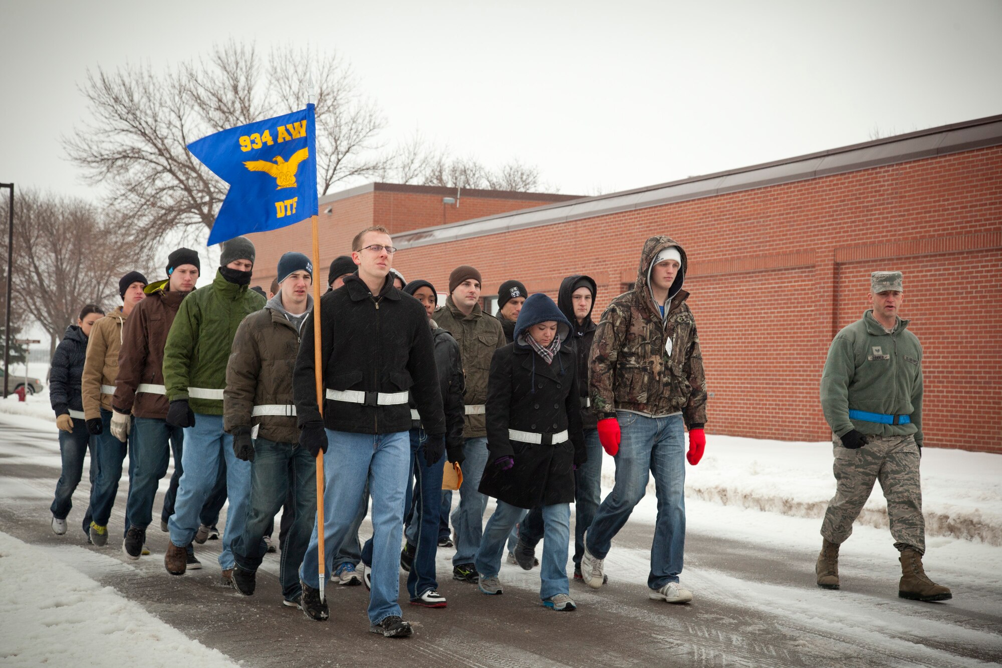 The 934th Airlift Wing Development Training Flight practices their marching skills on the way to chow despite the weather at the Minneapolis-St. Paul Air Reserve Station, Minn.  (U.S. Air Force photo/Shannon McKay)