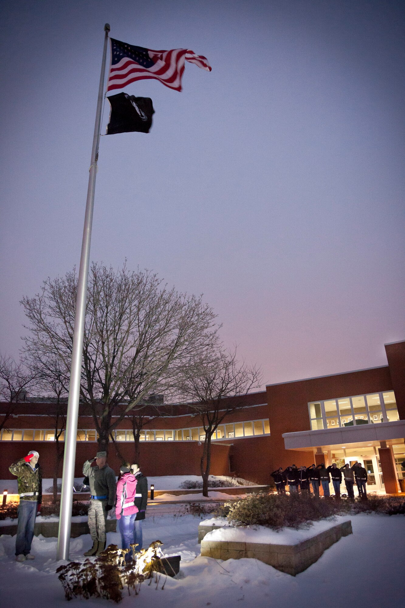 The 934th Development Training Flight posts the colors during reveille at the Minneapolis-St. Paul Air Reserve Station, Minn.  (U.S. Air Force photo/Shannon McKay)