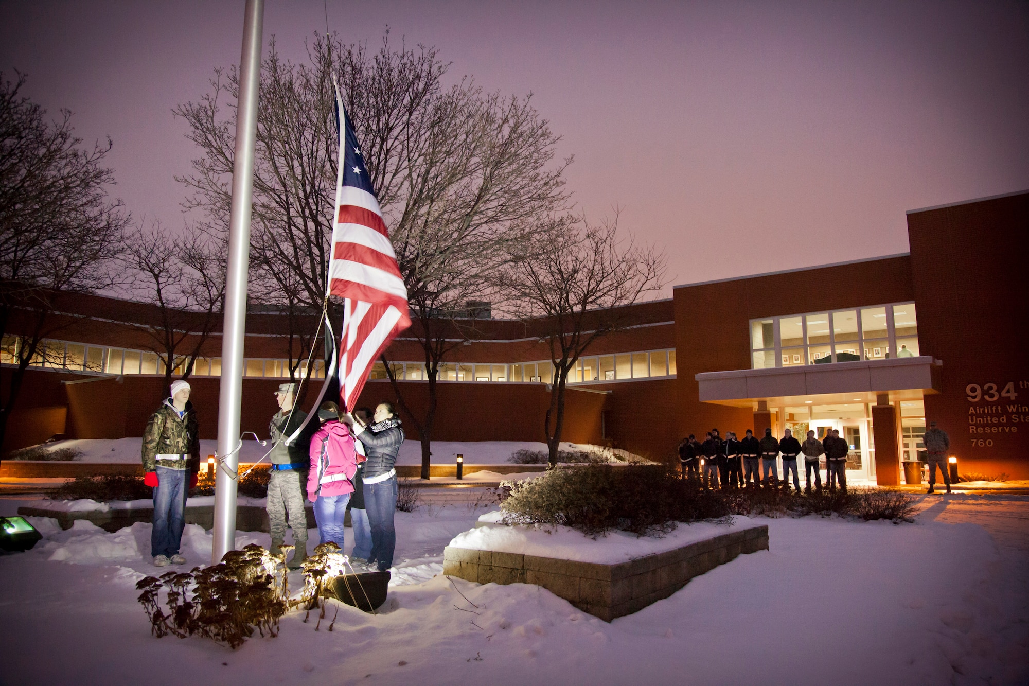 The 934th Development Training Flight posts the colors during reveille at the Minneapolis-St. Paul Air Reserve Station, Minn.  (U.S. Air Force photo/Shannon McKay)