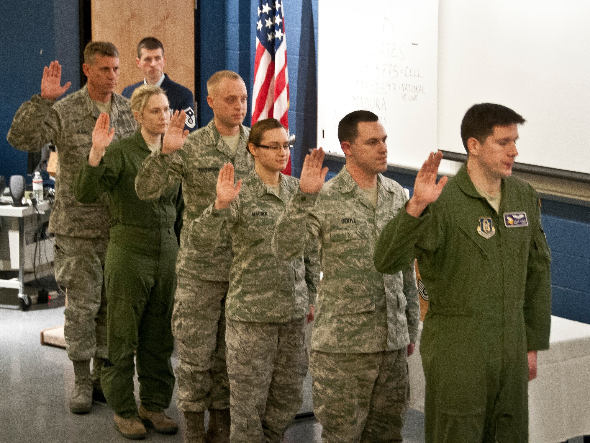 Staff Sgts. Gary Blount, Gabrielle Cohrs, Kurt Halvorson, Naomi Magner, Benjamin Oertle and Dylan Strom take an oath accepting the responsibilities of being a noncommissioned officer.  Staff Sergeants, Master Sergeants and Chief Master Sergeants from the 934th Airlift Wing were selected to be recognized in a ceremony based on rank milestones Feb. 9 at the Minneapolis-St. Paul Air Reserve Station, Minn.  (U.S. Air Force photo/Staff Sgt. Samantha Wagner)