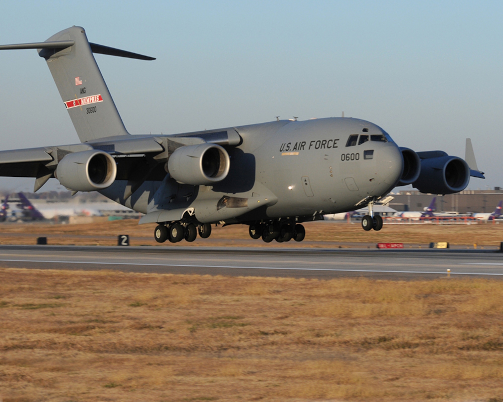 The first C-17 Globemaster aircraft delivered to the Tennessee Air National Guard's 164th Airlift Wing lands at Memphis International Airport. (U.S. Air Force photo/Tech.Sgt. Robin Olsen)





