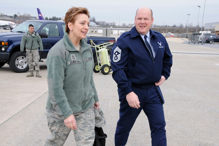 Chief Master Sgt. Denise Jelinski-Hall, senior enlisted leader to the chief, National Guard Bureau (left) is escorted by Command Chief Master Sgt. Steven Hile on the flightline at the 193rd Special Operations Wing, Feb. 7, 2013. Chief Master Sgt. Jelinski Hall was at the 193rd SOW to attend the promotion ceremony of Maj. Gen. Eric Weller, former 193rd SOW commander and current deputy commander for Mobilization and Reserve Affairs, U.S. Special Operations Command. (U.S. Air Force Photo by Tech. Sgt Culeen Shaffer/Released)