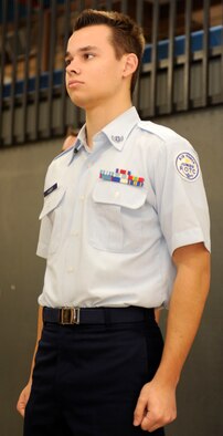 Julian Kandt, Douglas High School Air Force junior ROTC cadet, stands at attention during an open ranks inspection at Douglas High School in Box Elder, S.D., Feb. 11, 2013. Kandt is a foreign exchange student from Cologne, Germany, and is interested in becoming a pilot for the German Air Force. (U.S. Air Force photo by Airman Ashley J. Thum/Released) 