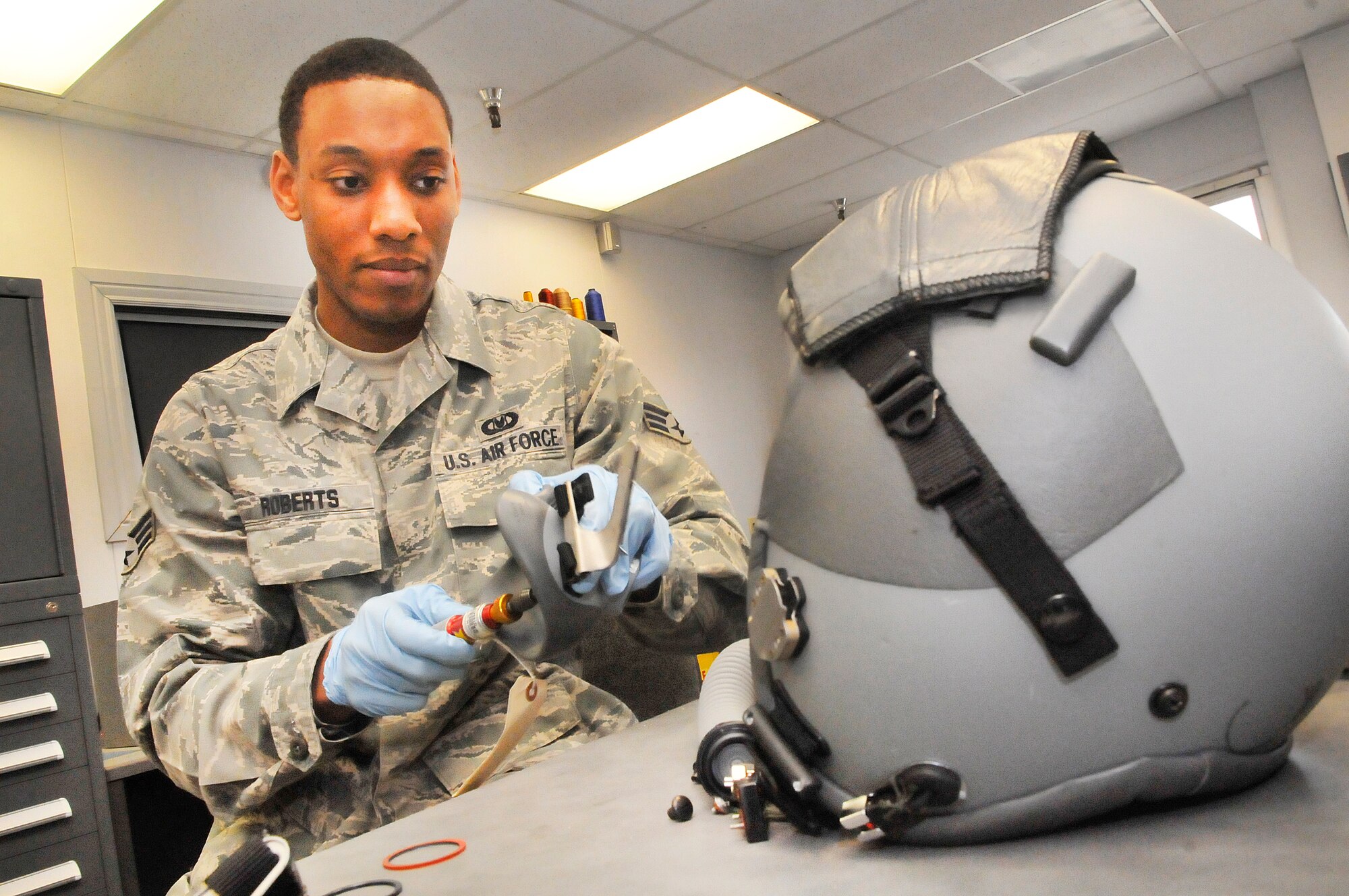 Senior Airman Stephen Roberts, aircrew flight equipment technician, tears down, cleans, reassembles and tests oxygen masks and flight helmets in the life support shop for the 339th Flight Test Squadron. This process is done every 30 days to ensure the helmets are in good working condition.  (U. S. Air Force photo/Sue Sapp)