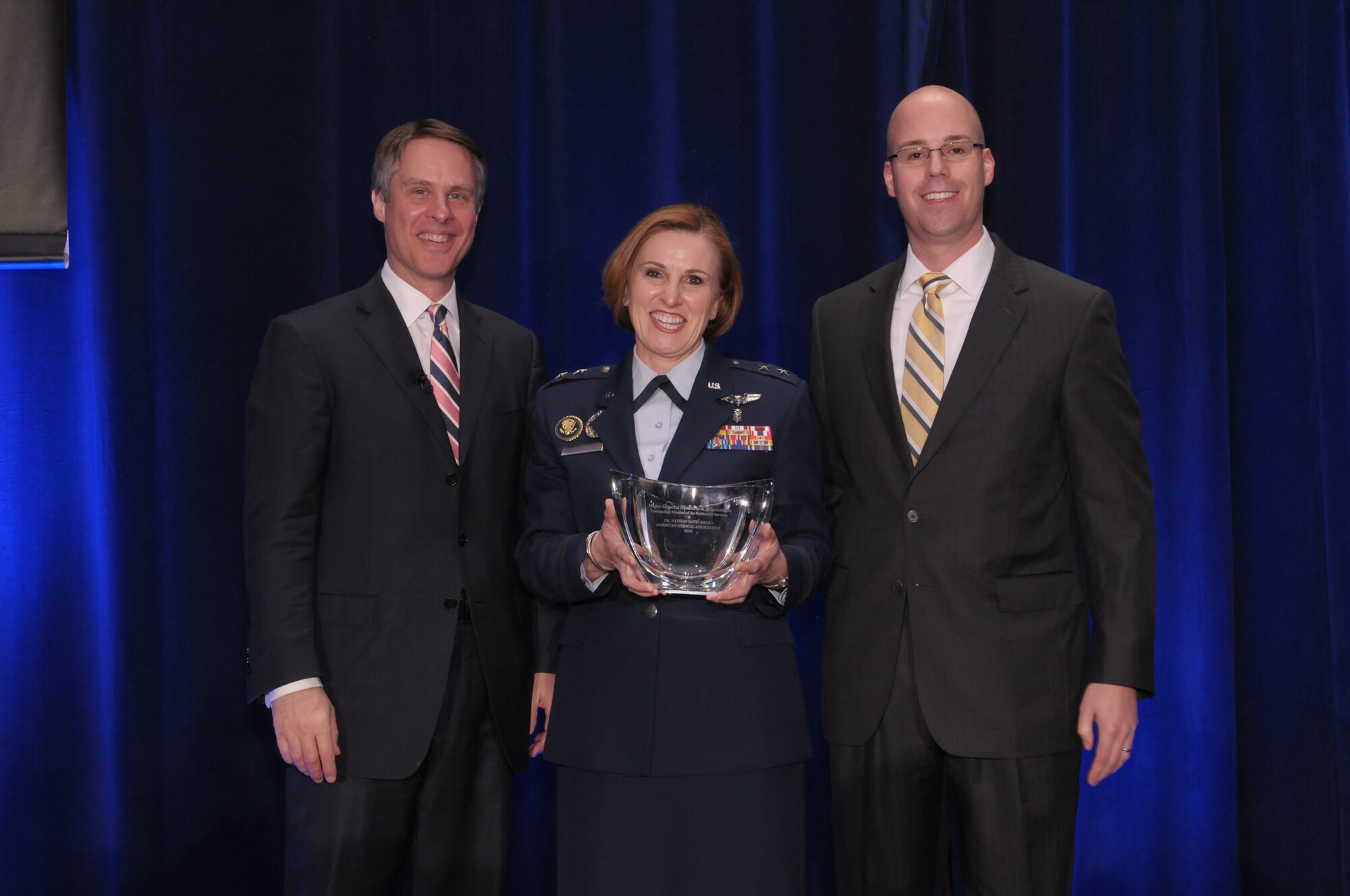 Assistant Air Force Surgeon General, medical force development and nursing services, Maj. Gen. Kimberly Siniscalchi, received the American Medical Association’s (AMA) top government service award in health care, the Dr. Nathan Davis Award for Outstanding Government Service. She was honored at the AMA’s National Advocacy Conference in Washington, D.C. on Feb 12, 2013. The group shot is with Terry Moran, co-anchor of ABC News "Nightline" (left) and AMA Board Chair Steven J. Stack, M.D. (right). (AMA courtesy photo)