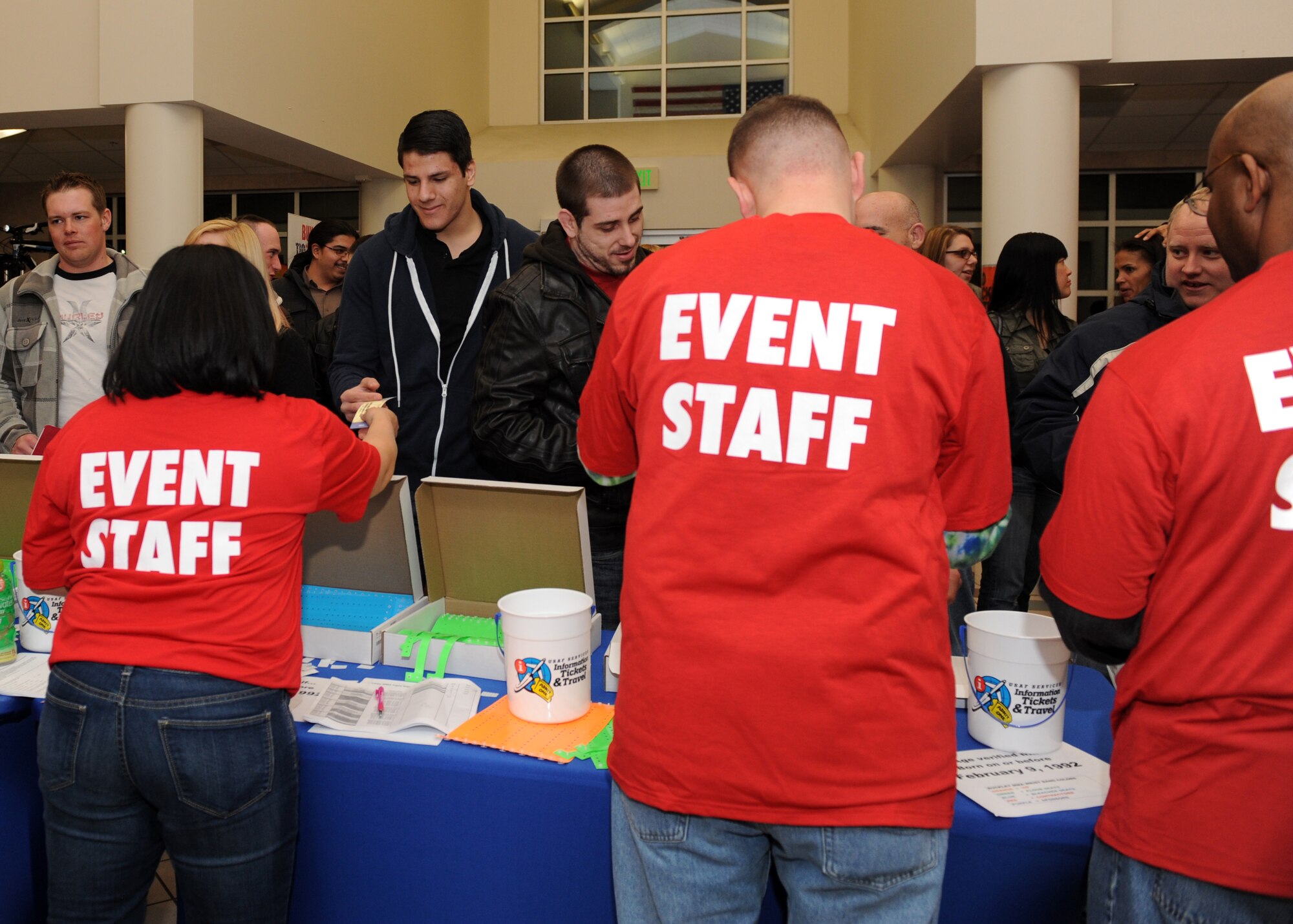 Volunteers take tickets for the Buckley MMA Fight Night Feb. 9, 2013, at the Buckley Air Force Base Fitness Center. This event was the first sanctioned mixed martial arts event on a Colorado military base. (U.S. Air Force photo by Senior Airman Marcy Glass/Released)
