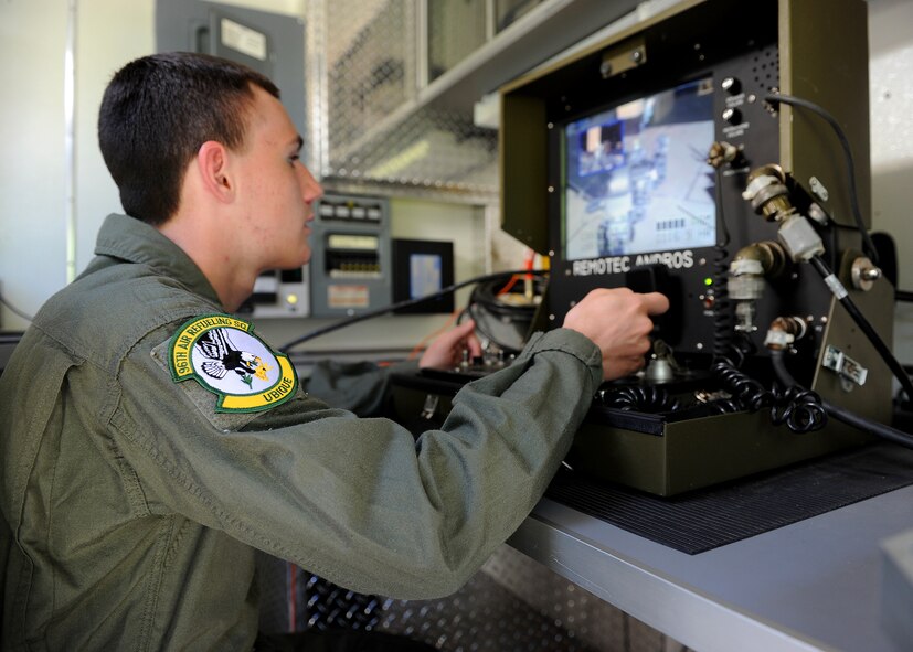 Caleb Jensen, Pilot For a Day participant, operates a bomb robot as part of the Pilot for a Day program at Joint Base Pearl Harbor-Hickam, Hawaii, Feb. 8, 2013. After being diagnosed with aplastic anemia, a condition which causes the body to stop producing new blood cells, Caleb was recommended for the program which aims to benefit children in the local community suffering from serious or chronic illnesses. (U.S. Air Force photo/Tech. Sgt. Jerome S. Tayborn)