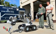 Caleb Jensen, Pilot For a Day participant, operates a bomb robot with the help of Senior Airman Vincent Irr, 647th Civil Engineer Squadron munitions apprentice as part of the Pilot for a Day program at Joint Base Pearl Harbor-Hickam, Hawaii, Feb. 8, 2013. Caleb was selected for the Pilot For a Day program after successfully undergoing a bone marrow transplant and completing treatment for aplastic anemia, a condition which causes the body to stop producing new blood cells. The goal of this program is to benefit children and their families in the local community who have catastrophic illnesses. It is not directed at any one illness or disease, and not restricted to children with "terminal" illnesses. For many children with catastrophic, but not "terminal" illnesses, the Pilot for a Day Program can be a significant part of their recovery. (U.S. Air Force photo/Tech. Sgt. Jerome S. Tayborn)