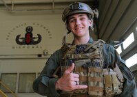 Caleb Jensen, Pilot For a Day participant, poses for a photo at the 647th Civil Engineer Squadron, Explosive Ordnance Disposal work center shortly after touring the facility as part of the Pilot for a Day program at Joint Base Pearl Harbor-Hickam, Hawaii, Feb. 8, 2013. The original "Pilot for a Day" program began in December of 1994, organized by Captain Rory "Ox" Blackburn at Randolph Air Force Base, Texas. (U.S. Air Force photo/Tech. Sgt. Jerome S. Tayborn)