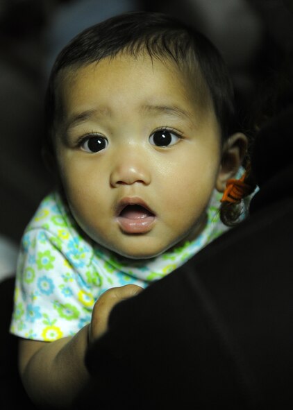 Kalia Jensen, sister of Caleb Jensen, Pilot For a Day participant and aplastic anemia survivor, sits aboard a KC-135 Stratotanker simulator with her brother and family as part of the Pilot for a Day program at Joint Base Pearl Harbor-Hickam, Hawaii, Feb. 02, 2013. The "Pilot For A Day" private organization invites children of all ages, military or civilian, to be guests of the 15th Wing and one of its flying squadrons for an entire day. In so doing, the goal is to give each child a special day and a break from whatever challenges they may be facing. (U.S. Air Force photo/Tech. Sgt Jerome S. Tayborn)