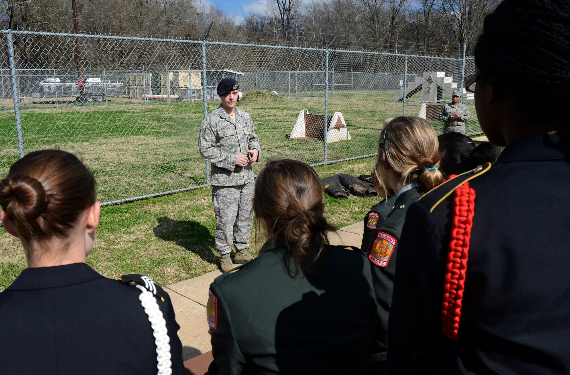 Staff Sgt. Andrew Phillips, 2nd Security Forces Squadron military working dog handler, speaks to Junior Reserve Officer Training Corps cadets from North Desoto High School, La., during a base tour on Barksdale Air Force Base, La., Feb. 8. The Barksdale Community Relations program regularly hosts base tours to educate interested groups on the mission and history of the base. (U.S. Air Force photo/Staff Sgt. Chad Warren)