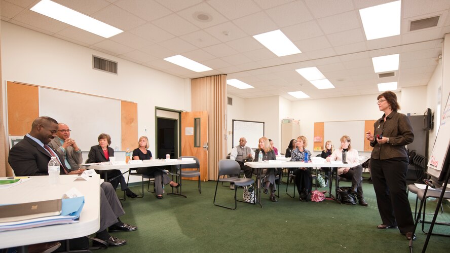 Pattie Porter, conflict management consultant, listens to class partcipants' input about different scenarios during a conflict management coaching workshop at the base chapel on Hurlburt Field, Fla., Feb. 11, 2013. The two-day workshop enhanced participants' leadership skills to deal with conflict at the lowest level possible. (U.S. Air Force photo/Senior Airman Krystal M. Garrett) 