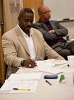 Chief Master Sgt. Marcus Snoddy, command chief of the 96th Test Wing on Eglin Air Force Base, Fla., take notes during a Conflict Management Coaching workshop at the base chapel on Hurlburt Field, Fla., Feb. 12, 2013. The two-day workshop consisted of class participation in step-by-step scenarios, helping participants learn the difference between mediation and conflict coaching. (U.S. Air Force photo/Senior Airman Krystal M. Garrett)