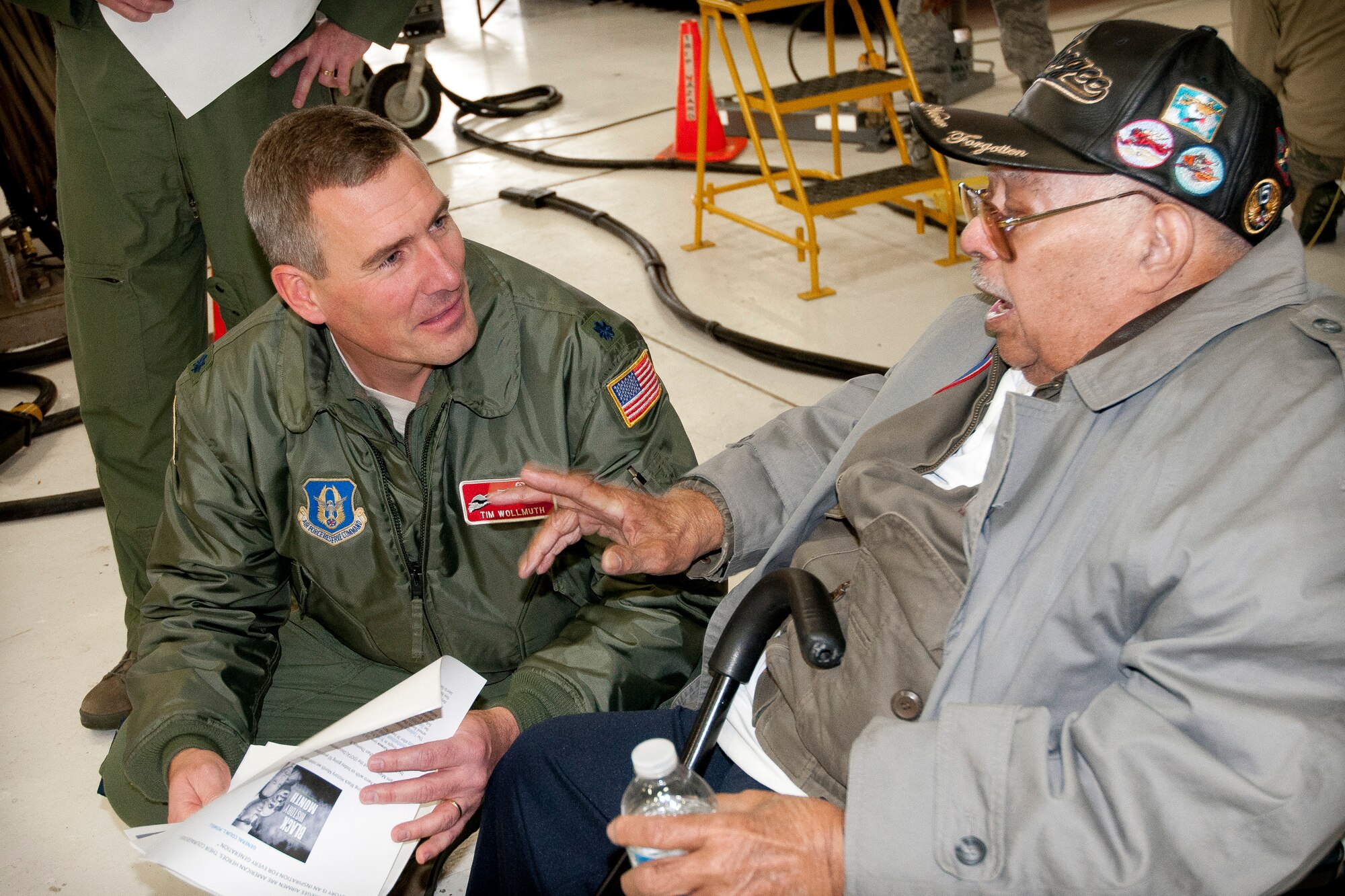 Tuskeegee Airman Lt. Col. (Retired) Hiram Mann talks with Lt. Col. Timothy Wollmuth, 934th Operations Group deputy commander, during a visit at the Minneapolis-St. Paul Air Reserve Station, Minn.  (U.S. Air Force photo/Paul Zadach)